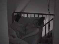 A woman may be seen masturbating wonderfully with her legs spread wide on a hidden camera.